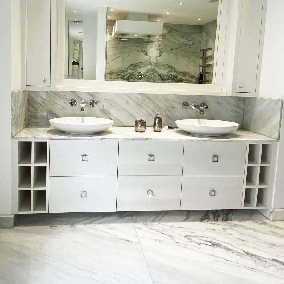 Bespoke bathroom cabinetry with flanking storage