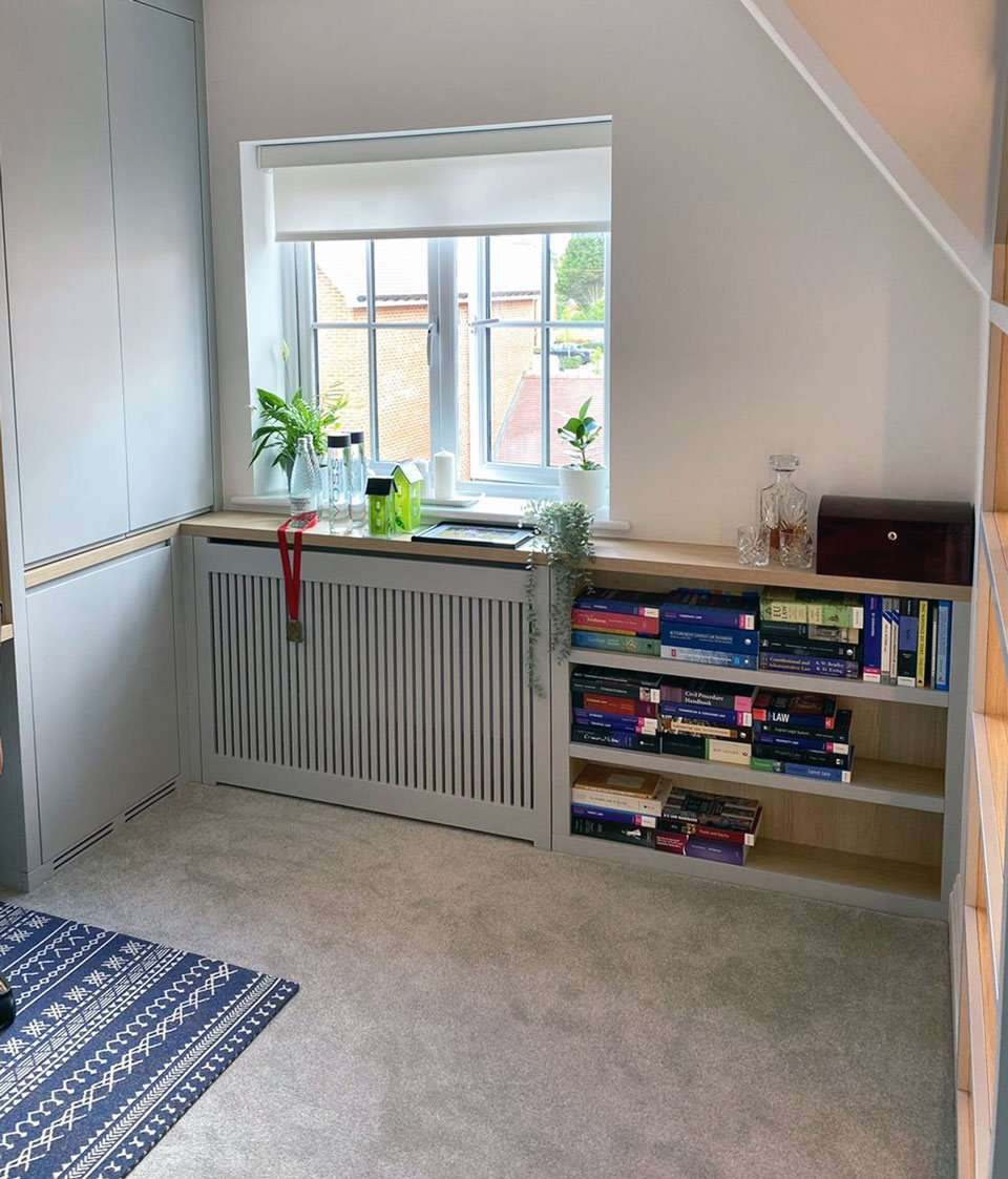 The sloping ceiling turned into full-height fitted storage
