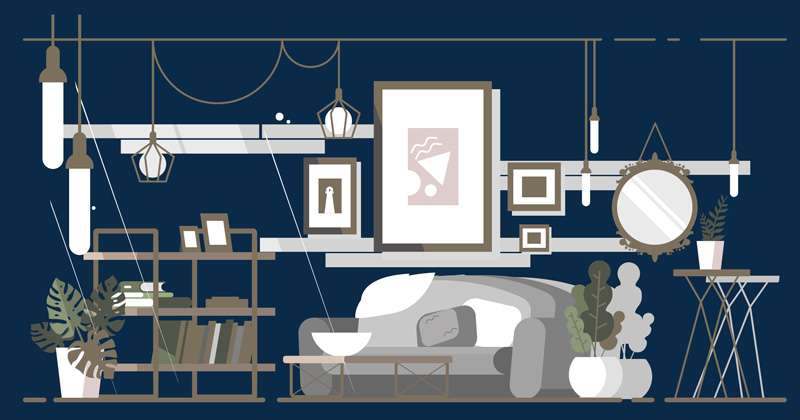 A living room wall with framed pictures above a fitted sideboard