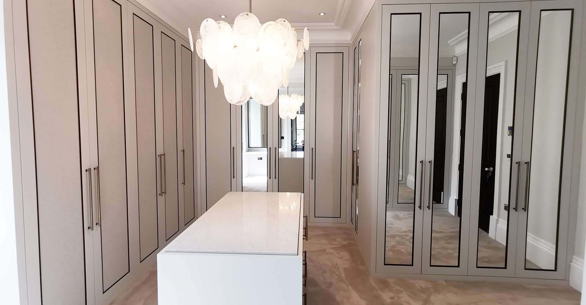 Amy's finished walk-in wardrobe with mirrored shaker doors