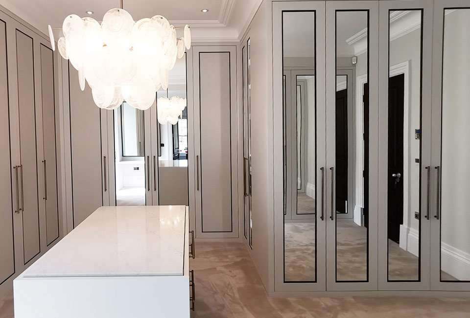 Sprayed shaker doors and framed mirrors in the finished dressing room