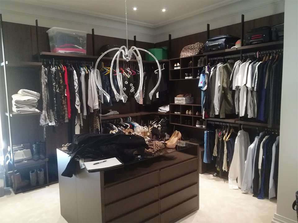 Cluttered walk-in wardrobe before Befilo