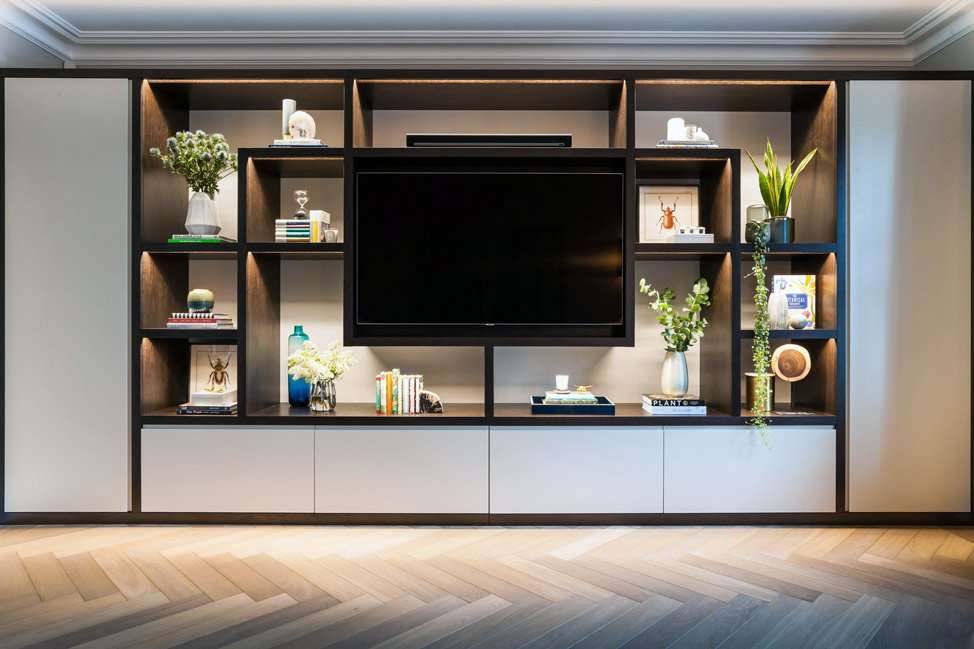 Fitted living room cabinetry with open shelving