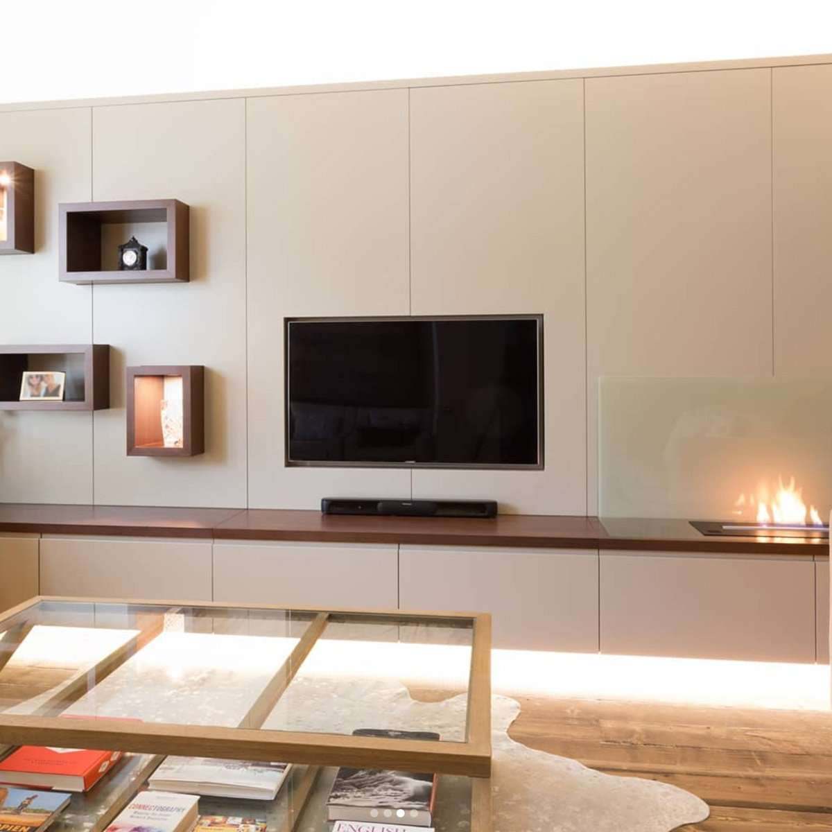 Fitted living room joinery around a fireplace