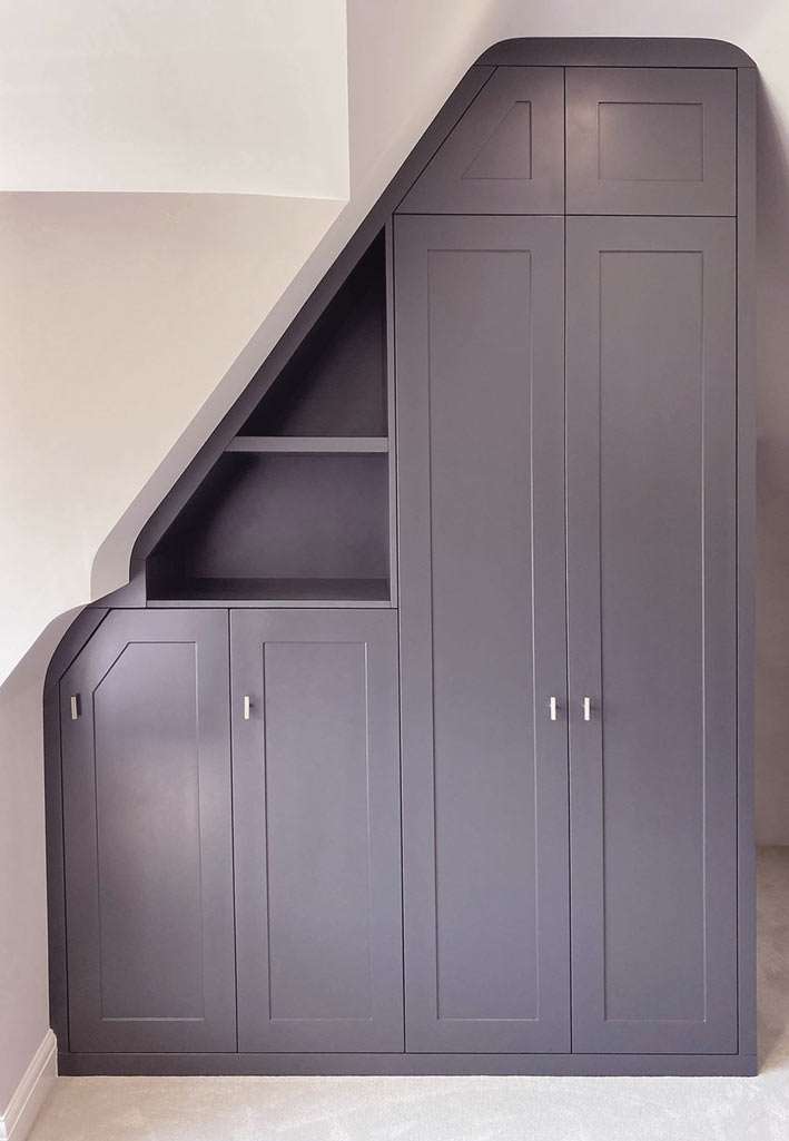Fitted alcove shelving flanking a chimney breast