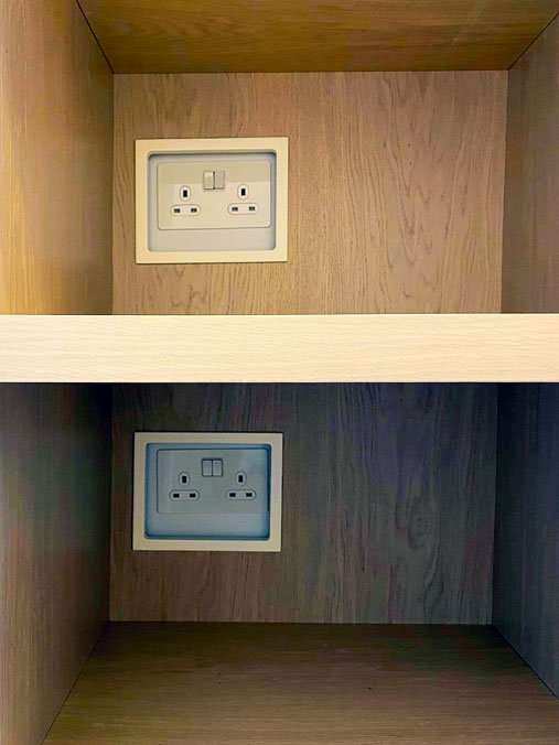 A power socket built flush into a fitted unit